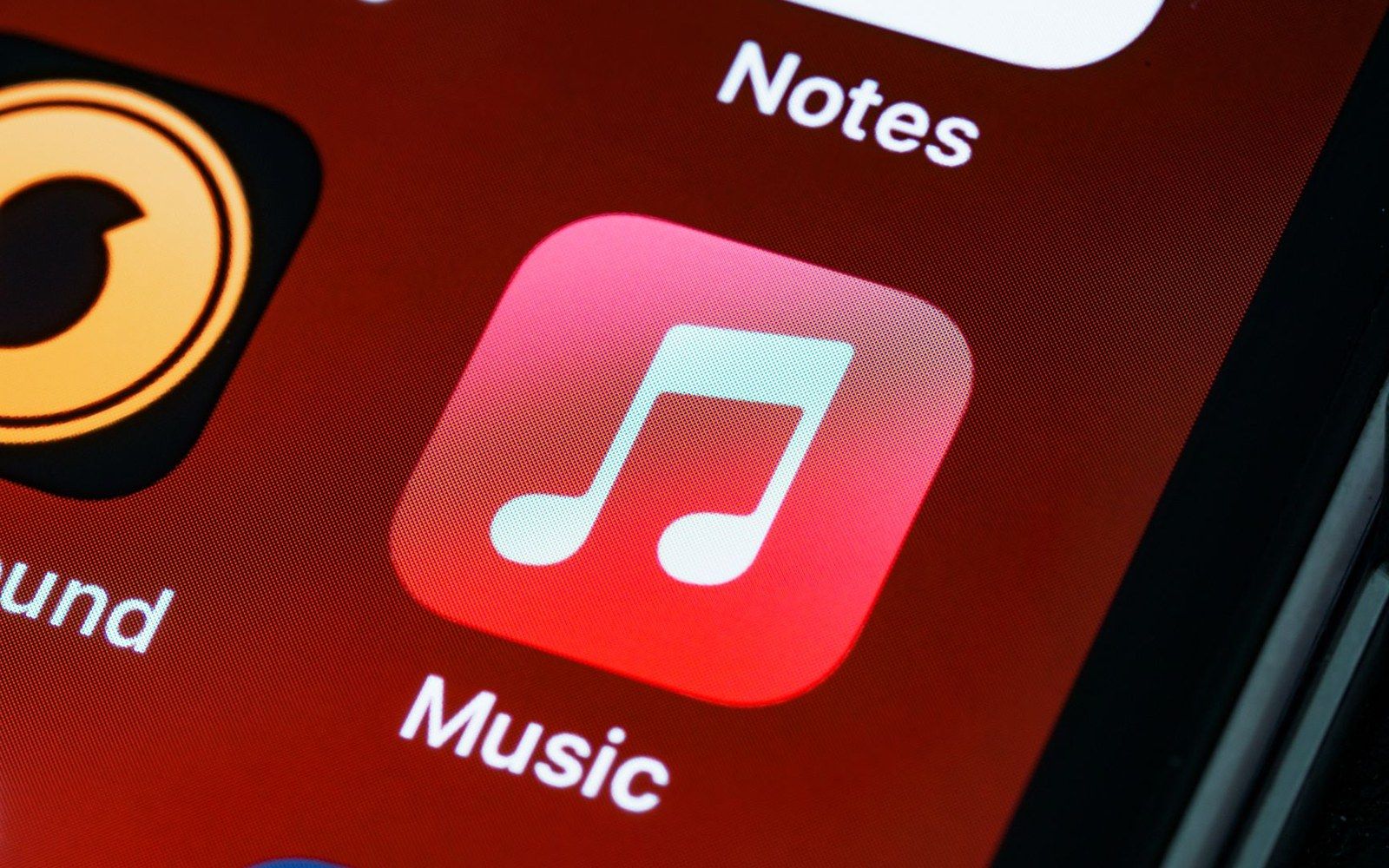 The iOS Music app icon on a phone screen