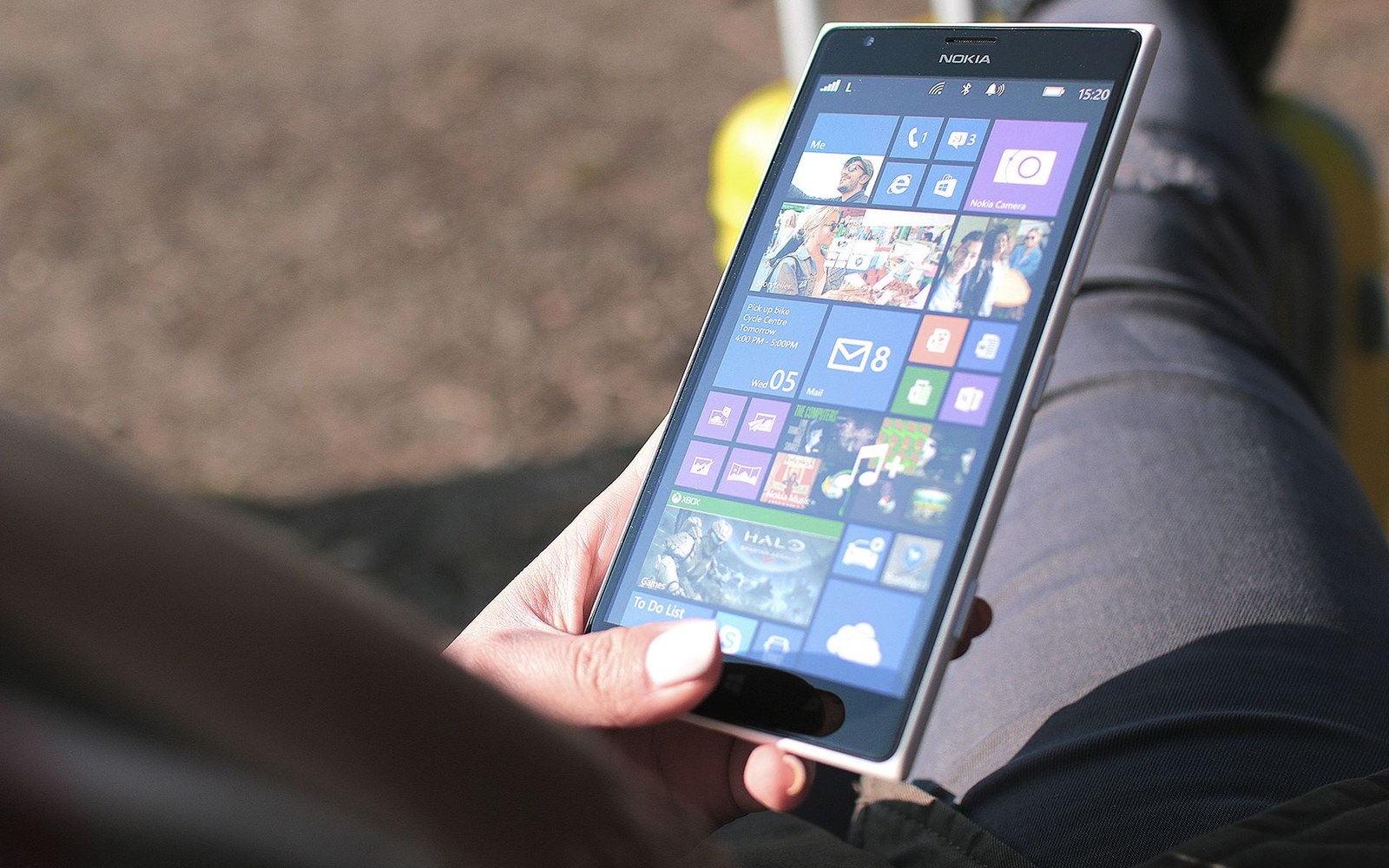 A modern touchscreen handset, photographed in place of the 1994 model